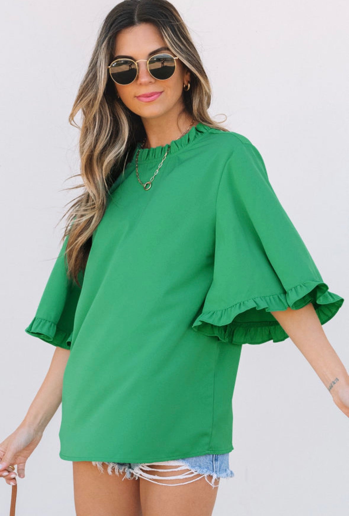 Green top with ruffle sleeve