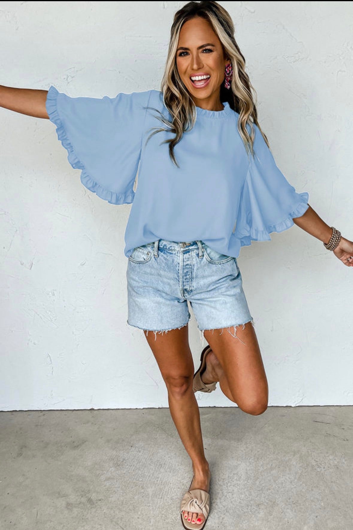 Light blue top with ruffle sleeve