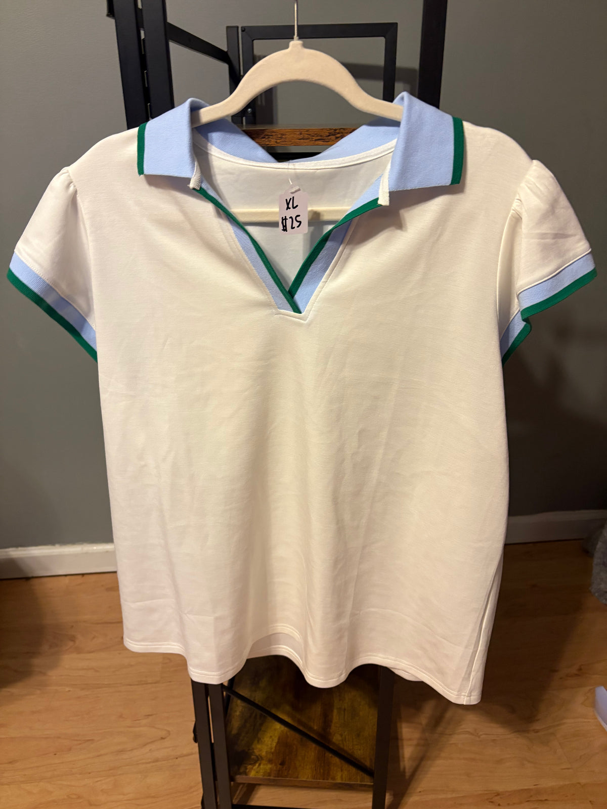 White top with green trim